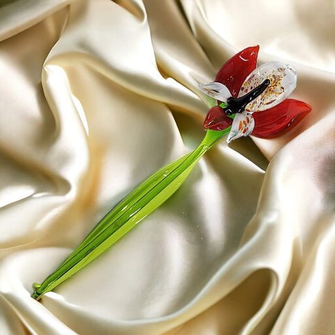 a single flower on a satin fabric