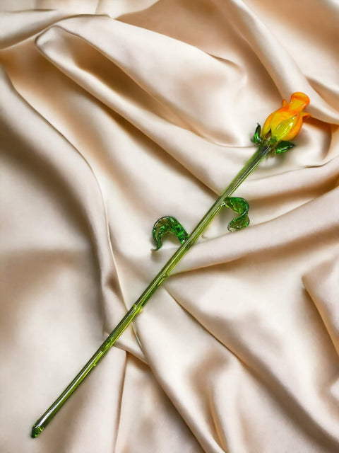 a single yellow flower on a white satin